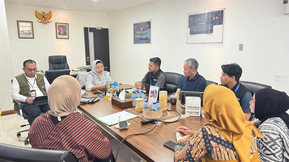 A working session around a boardroom table with senior care operators in Indonesia